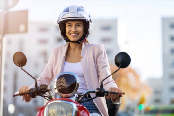 Woman Riding Scooter In The City